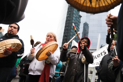 Indigenous protesters drummed and sang outside the Enbridge Northern Gateway hearings, which faced more than 1,000 protesters when it began hearings in Vancouver, British Columbia, on January 14, 2013. Photo by David P. Ball