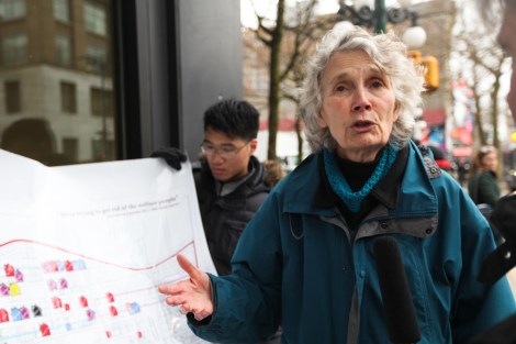 Jean Swanson, with the Carnegie Community Action Project (CCAP), explains a colour-coded map illustrating rent increases in the Downtown Eastside. Photo by David P. Ball