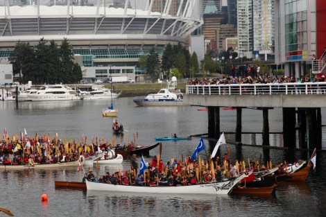 Hundreds of paddlers took to Vancouver's False Creek the day before residential school hearings opened.